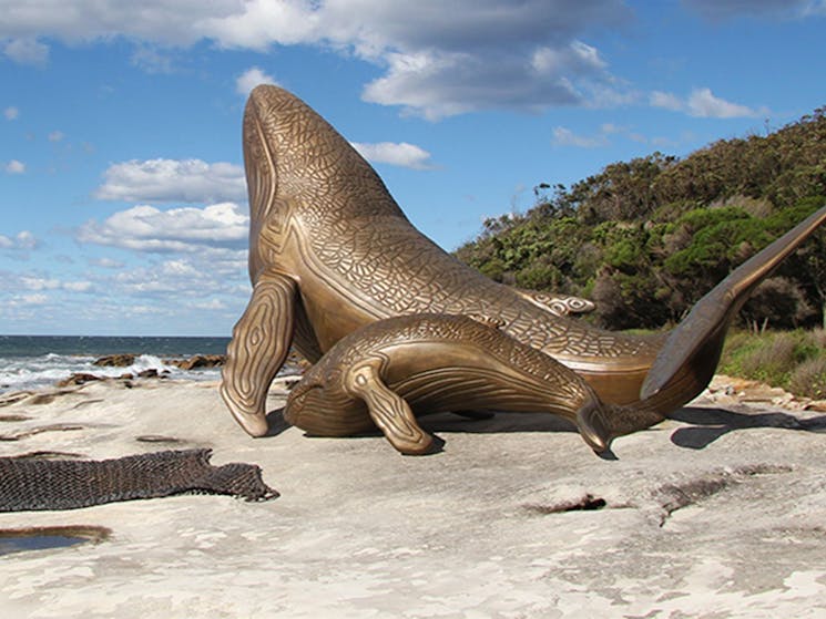Bronze sculptures of whales behind Commemoration Flat picnic area, Kurnell. Photo credit: Natasha