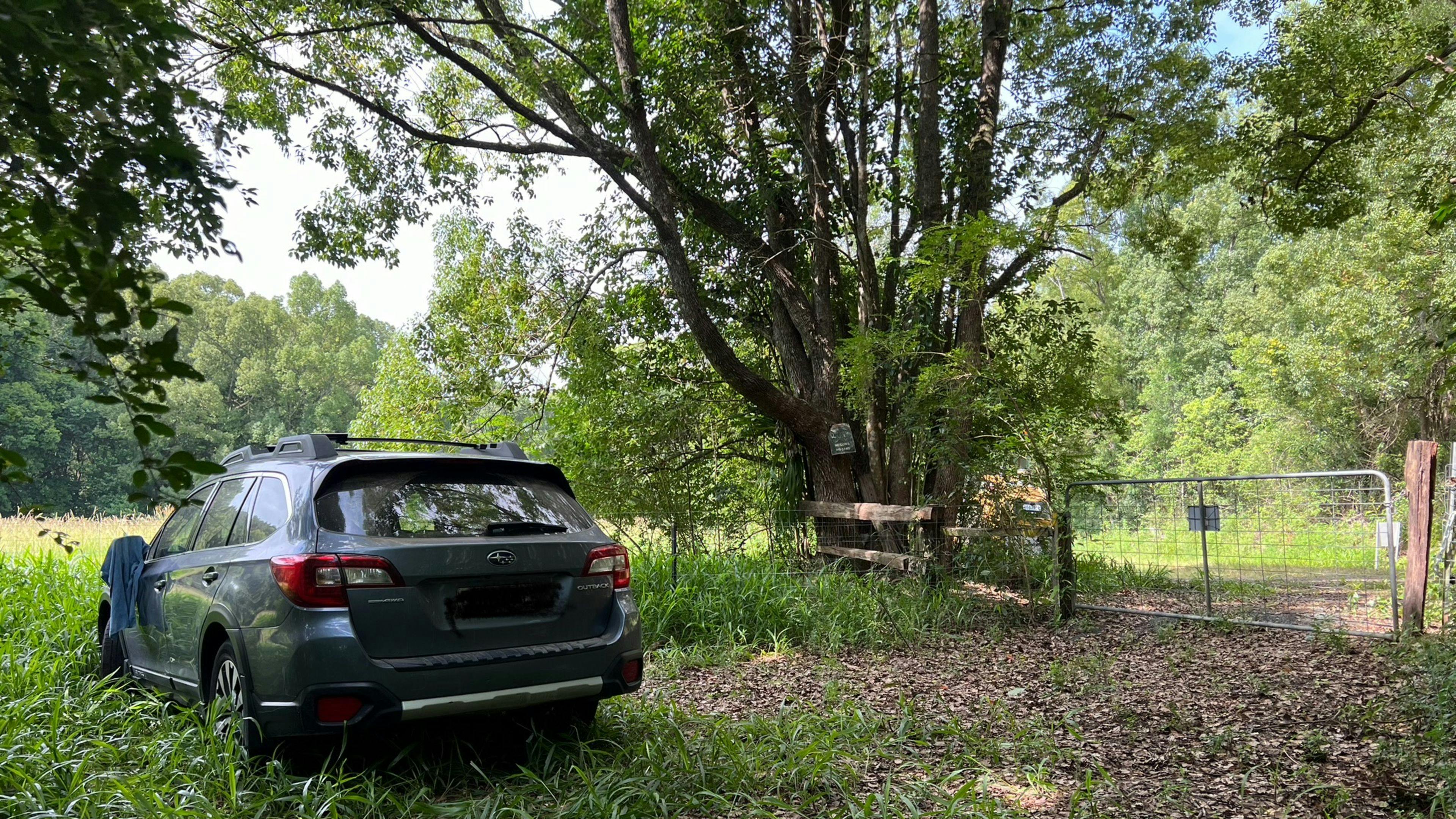 Car camping area through large gate