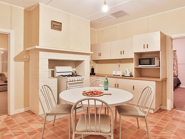 Kitchen and dining table at Willandra Cottage, Willandra National Park. Photo: Vision House