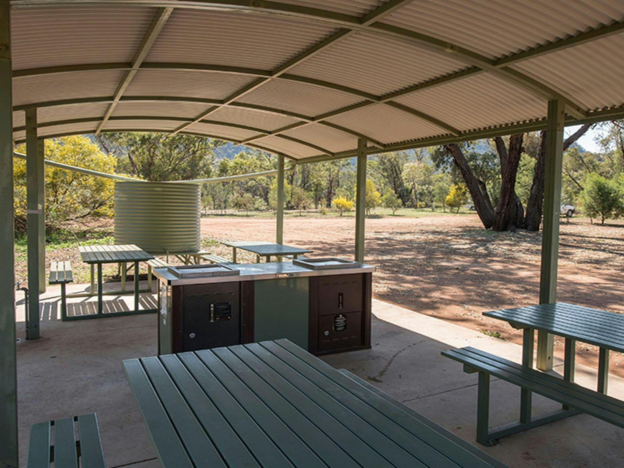 The barbecue area and undercover seating at Woolshed Flat campground in Cocoparra National Park.